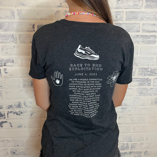 Race To End Exploitation Women’s T-Shirt